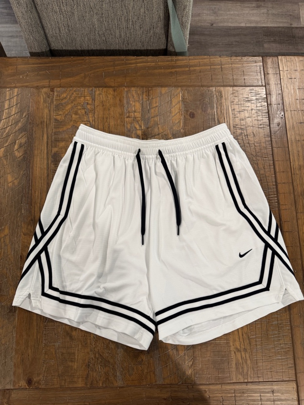 Nike White Athletic Shorts with Black Stripe Accents